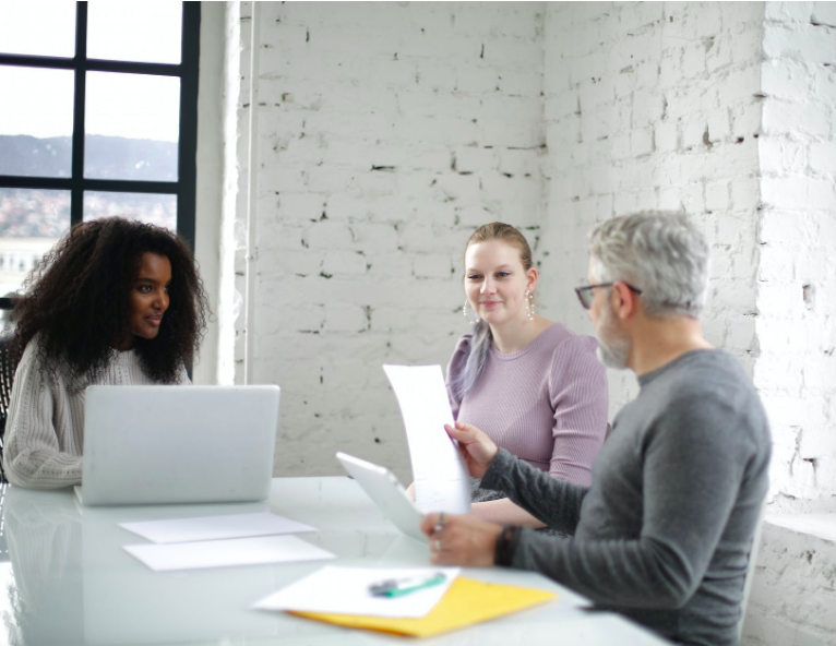 Find Business Inspiration for Your Startup with a group of people around a table